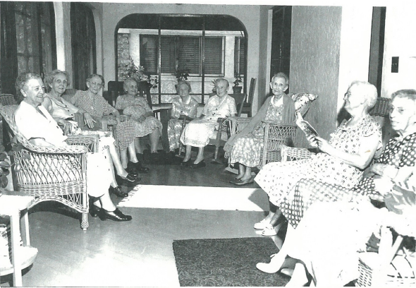 Residents Enjoying a Sunny Afternoon on the Patio